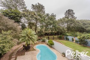 Casa em Condomínio à venda com 296m², 3 dormitórios, 1 suíte, 4 vagas, no bairro Terra Ville em PORTO ALEGRE