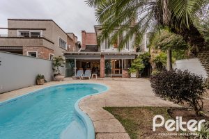 Casa em Condomínio à venda com 296m², 3 dormitórios, 1 suíte, 4 vagas, no bairro Terra Ville em PORTO ALEGRE