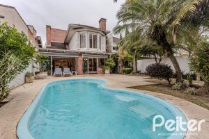 Casa em Condomínio à venda com 296m², 3 dormitórios, 1 suíte, 4 vagas, no bairro Terra Ville em PORTO ALEGRE