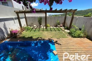 Casa em Condomínio à venda com 197m², 3 dormitórios, 1 suíte, 2 vagas, no bairro Vila Nova em PORTO ALEGRE