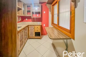Casa em Condomínio à venda com 102m², 3 dormitórios, 1 suíte, 1 vaga, no bairro Guarujá em Porto Alegre