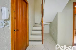 Casa em Condomínio à venda com 102m², 3 dormitórios, 1 suíte, 1 vaga, no bairro Guarujá em Porto Alegre