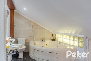 Casa em Condomínio à venda com 179m², 4 dormitórios, 1 suíte, 2 vagas, no bairro Cavalhada em Porto Alegre