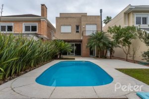 Casa em Condomínio à venda com 243m², 3 dormitórios, 3 suítes, 4 vagas, no bairro Terra Ville em PORTO ALEGRE
