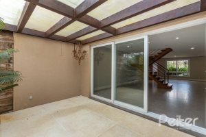 Casa em Condomínio à venda com 243m², 3 dormitórios, 3 suítes, 4 vagas, no bairro Terra Ville em PORTO ALEGRE