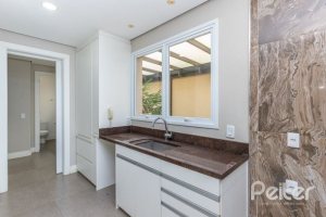 Casa em Condomínio à venda com 243m², 3 dormitórios, 3 suítes, 4 vagas, no bairro Terra Ville em PORTO ALEGRE