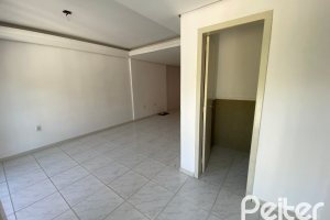 Casa à venda com 223m², 3 dormitórios, 1 suíte, 3 vagas, no bairro Guarujá em Porto Alegre