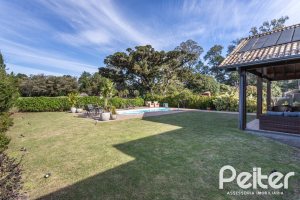 Casa em Condomínio à venda com 366m², 4 dormitórios, 4 suítes, 3 vagas, no bairro Terra Ville em PORTO ALEGRE