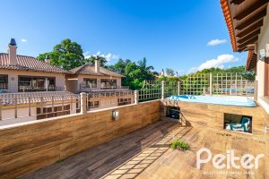 Casa em Condomínio à venda com 327m², 3 dormitórios, 3 suítes, 3 vagas, no bairro Tristeza em PORTO ALEGRE