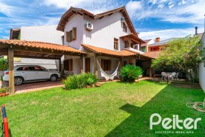 Casa em Condomínio à venda com 216m², 3 dormitórios, 3 suítes, 2 vagas, no bairro Hípica em Porto Alegre