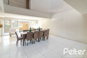 Casa em Condomínio à venda com 386m², 3 dormitórios, 1 suíte, 2 vagas, no bairro Vila Assuncao em Porto Alegre