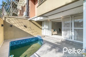 Casa em Condomínio à venda com 386m², 3 dormitórios, 1 suíte, 2 vagas, no bairro Vila Assuncao em Porto Alegre