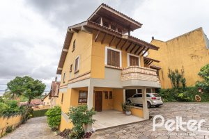 Casa em Condomínio à venda com 186m², 3 dormitórios, 1 suíte, 2 vagas, no bairro Jardim Isabel em Porto Alegre