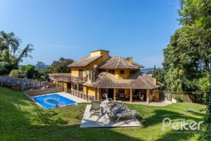 Casa à venda com 600m², 4 dormitórios, 4 suítes, 4 vagas, no bairro Vila Conceição em Porto Alegre