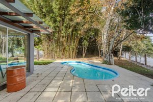 Casa em Condomínio à venda com 304m², 4 dormitórios, 4 suítes, 3 vagas, no bairro Tristeza em Porto Alegre