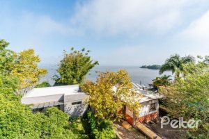 Casa em Condomínio à venda com 296m², 4 dormitórios, 2 suítes, 3 vagas, no bairro Tristeza em Porto Alegre