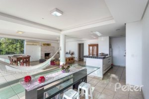 Casa à venda com 420m², 4 dormitórios, 1 suíte, 4 vagas, no bairro Nonoai em Porto Alegre