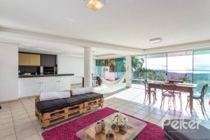 Casa à venda com 420m², 4 dormitórios, 1 suíte, 4 vagas, no bairro Nonoai em Porto Alegre