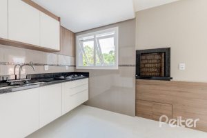 Casa em Condomínio à venda com 233m², 3 dormitórios, 1 suíte, 3 vagas, no bairro Vila Assunção em Porto Alegre