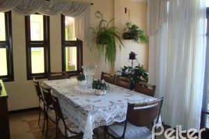 Casa em Condomínio à venda com 300m², 4 dormitórios, 1 suíte, 2 vagas, no bairro Nonoai em Porto Alegre