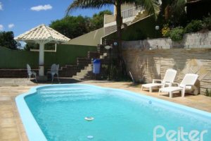 Casa em Condomínio à venda com 300m², 4 dormitórios, 1 suíte, 2 vagas, no bairro Nonoai em Porto Alegre