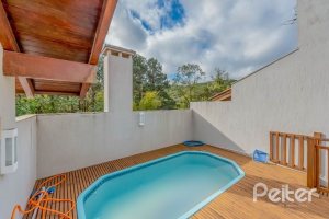 Casa em Condomínio à venda com 334m², 4 dormitórios, 1 suíte, 2 vagas, no bairro Jardim Isabel em Porto Alegre