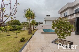 Casa em Condomínio à venda com 503m², 4 dormitórios, 4 suítes, 4 vagas, no bairro Terra Ville em PORTO ALEGRE
