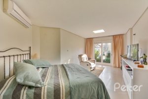 Casa em Condomínio à venda com 535m², 4 dormitórios, 4 suítes, 4 vagas, no bairro Terra Ville em PORTO ALEGRE