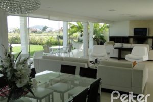 Casa em Condomínio à venda com 472m², 4 dormitórios, 3 suítes, 2 vagas, no bairro Terra Ville em PORTO ALEGRE