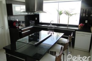 Casa em Condomínio à venda com 472m², 4 dormitórios, 3 suítes, 2 vagas, no bairro Terra Ville em PORTO ALEGRE