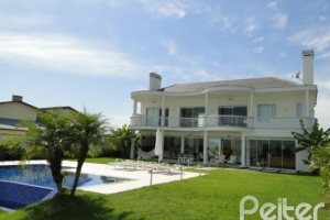 Casa em Condomínio à venda com 472m², 4 dormitórios, 3 suítes, 2 vagas, no bairro Terra Ville em PORTO ALEGRE