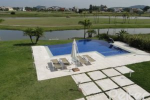 Casa em Condomínio à venda com 472m², 4 dormitórios, 3 suítes, 2 vagas, no bairro Terra Ville em PORTO ALEGRE