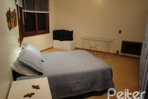 Casa em Condomínio à venda com 1350m², 7 dormitórios, 5 suítes, 4 vagas, no bairro Cavalhada em PORTO ALEGRE