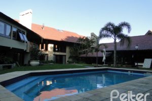 Casa em Condomínio à venda com 1350m², 7 dormitórios, 5 suítes, 4 vagas, no bairro Cavalhada em PORTO ALEGRE