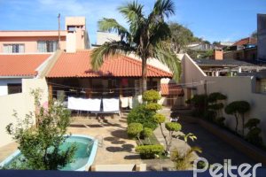 Casa à venda com 520m², 4 dormitórios, 1 suíte, 3 vagas, no bairro Tristeza em Porto Alegre