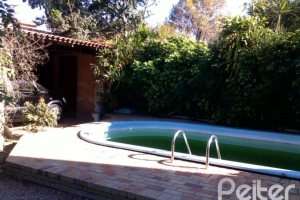 Casa à venda com 219m², 3 dormitórios, 1 suíte, 3 vagas, no bairro Tristeza em Porto Alegre